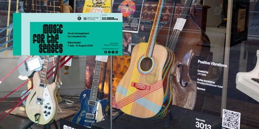 J R Oatts painted guitar on show in Manchester